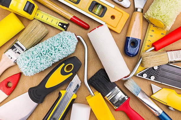Accueil set of working tools and accessories for home renovation on wooden background